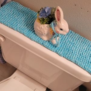 Handmade knit toilet tank topper.